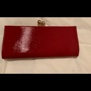 MMS DESIGN STUDIO deep red evening clutch with gold clasp.Surface has li…